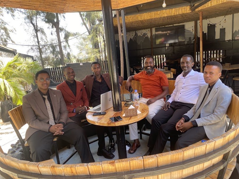 The Entelon team with Liban Mugabo around a table